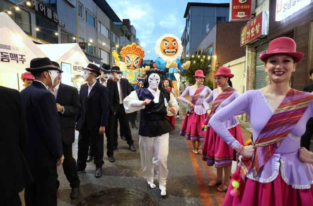 Andong Maskdance Festival 2026 parade with traditional masks and performers in an Andong downtown street
