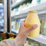 Korean banana milk where to buy 2026 thumbnail showing a chilled jar-shaped banana milk bottle in a Korean convenience store