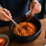 Buldak ramen flavors for beginners 2026 thumbnail showing spicy Korean noodles being prepared