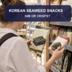 Korean seaweed snacks 2026 thumbnail showing a traveler choosing sealed gim packs in a Korean supermarket